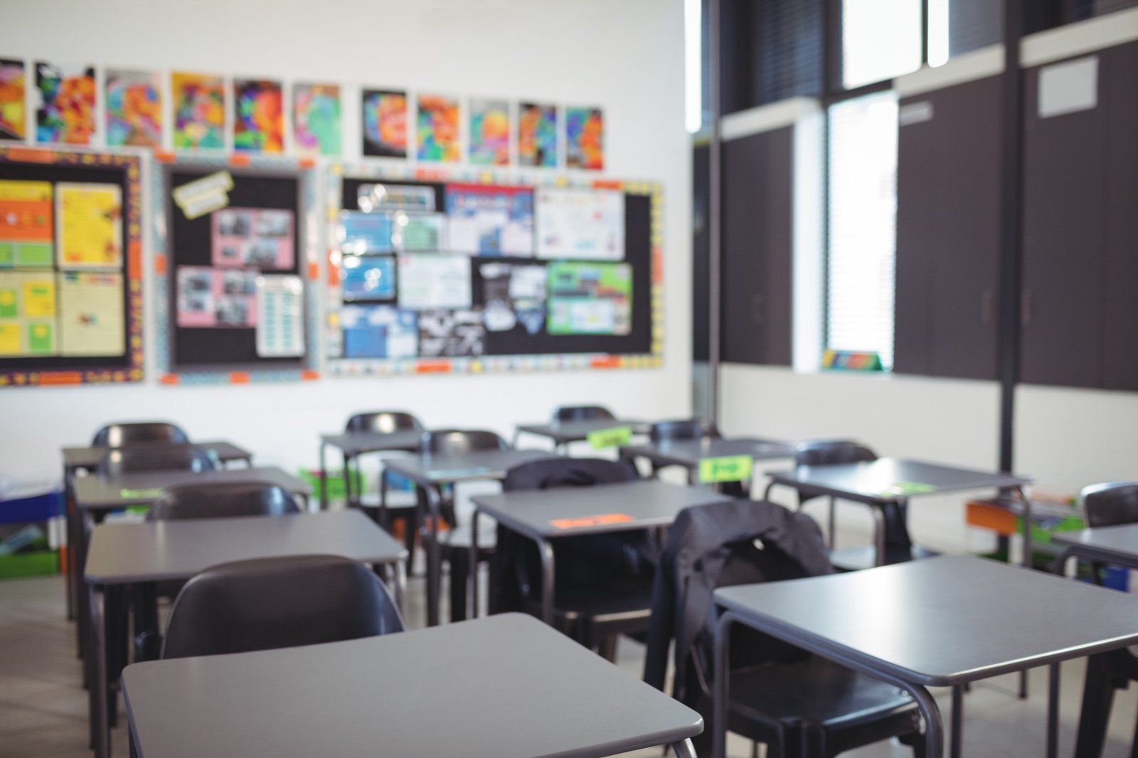 Empty classroom with desks and chairs