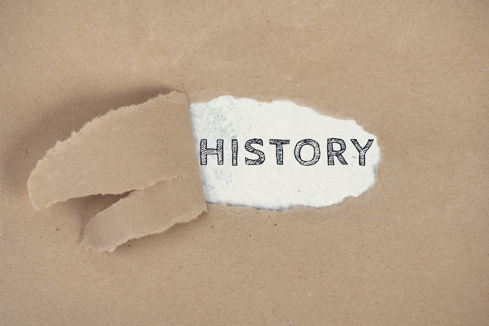 The word History on a ripped paper