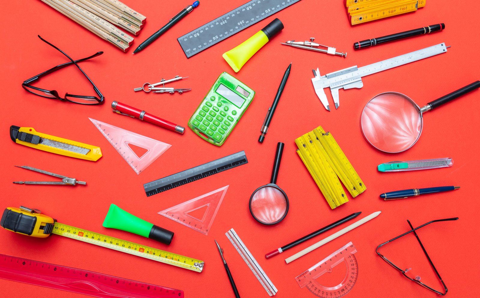 A collection of rulers, compasses, and other measuring tools